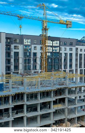 Construction Site Background. Hoisting Cranes And New Multi-storey Buildings. I.ndustrial Background