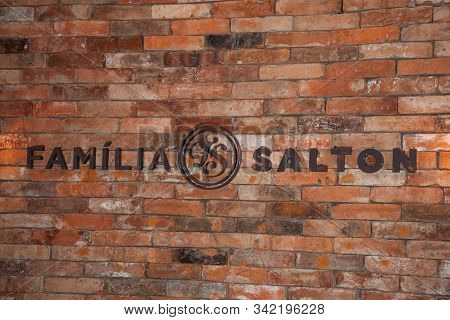 Bento Goncalves, Brazil - July 10, 2019. Sign On Brick Wall With The Brand Salton Family In The Salt