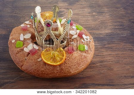 Epiphany Cake, Kings Cake, Roscon De Reyes Or Rosca De Reyes On Wooden Table