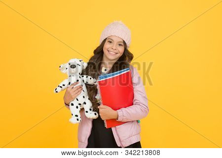 Classes Begin. Happy Small Girl Hold Toy Dog. Winter Holiday And Vacation. Childhood Happiness. Chil
