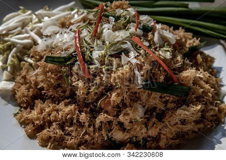 Asian Eating Food, Close-up Of Mee Grob Is An Sweet And Sour Crispy Noodles, Made From Thai Rice Noo