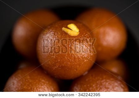Gulab Jamun In Bowl On Black Background. Indian Dessert Or Sweet Dish.