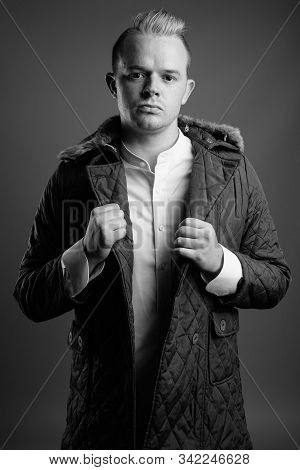 Portrait Of Man With Mohawk Hairstyle And Blond Hair