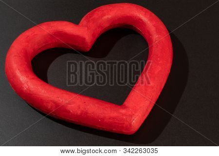 Grunge Red Paper Heart On A Black Background