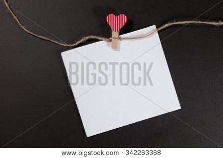 Paper Sticker Attached With Clothespins On A Rope And Hand Made Heart Makes. Valentines Day Black Ba