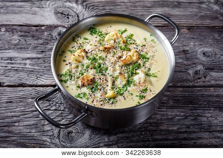 Creamy Roasted Garlic Cauliflower Soup With Asiago Cheese And A Crunchy Popped Quinoa And Chia Seed 