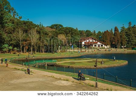 Gramado, Brazil - July 21, 2019. Wooded Park With The Joaquina Rita Bier Lake And Old House In Germa
