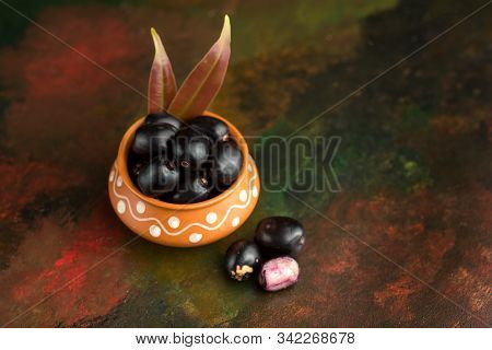 Jambolan Plum Or Jambul Or Jamun Fruit, Java Plum (syzygium Cumini) On Textured Background.