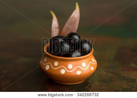 Jambolan Plum Or Jambul Or Jamun Fruit, Java Plum (syzygium Cumini) On Textured Background.