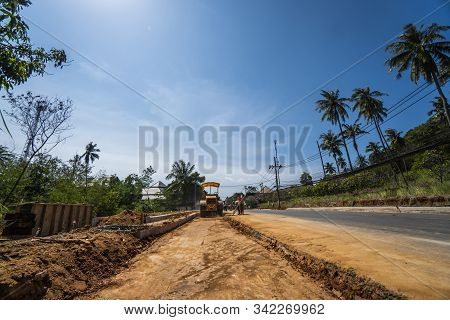 Thailand, Phuket - December 12, 2018: Road Rollers Working On The New Roads Construction Site. Heavy