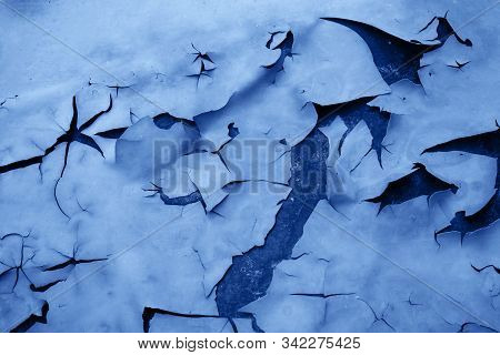 Background Of Peeled Off And Discolored Paint And A Rusty Surface Under It Toned In Blue Color Which