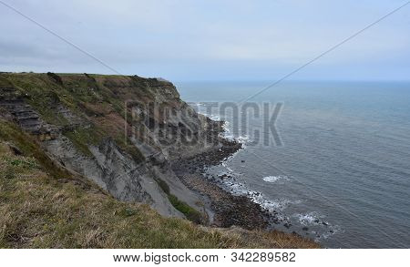 Eroding Sea Cliff In Robin Hood's Bay In England