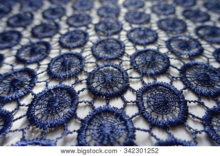 Close Up Of Dark Blue Lacy Fabric