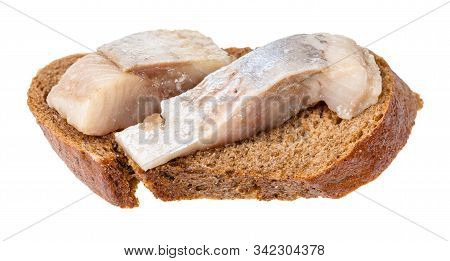 Open Sandwich With Rye Bread And Pickled Herring Isolated On White Background