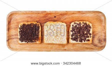 Top View Of Various Dutch Sweet Open Sandwich With Toast And Toppings From Chocolate Sprinkles On Wo