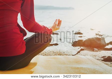 Unrecognizable Woman Practices Yoga In Lotus Position, Rear View. Biohacking, Meditation, Mental Hea