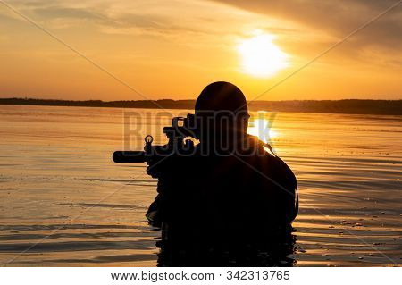 Fighter Of A Special Unit Leaves The Water And Prepares For The Start Of The Operation. The Concept