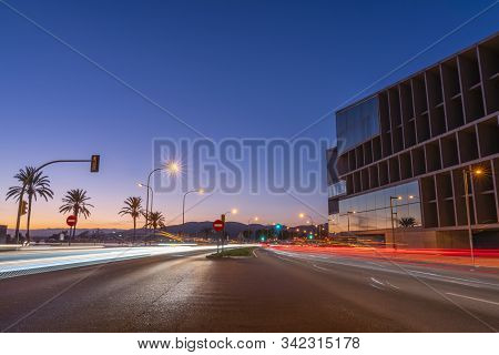 Centered Exposure Night Shot In The Promenade In The Bay Of Palma De Mallorca, With The Car Trails I