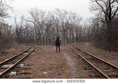 A Man On The Railway Steps On A Journey From Hustle And Bustle. Stock Photo.