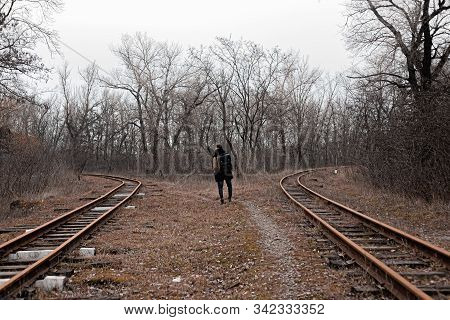 A Man On The Railway Steps On A Journey From Hustle And Bustle. Stock Photo.