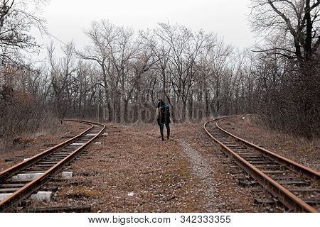 A Man On The Railway Steps On A Journey From Hustle And Bustle. Stock Photo.