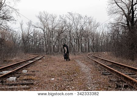 A Man On The Railway Steps On A Journey From Hustle And Bustle. Stock Photo.