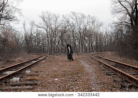 A Man On The Railway Steps On A Journey From Hustle And Bustle. Stock Photo.