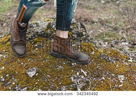 Guy Hiking In Comfortable Hiking Boots. Boots Close-up Stock Photo.