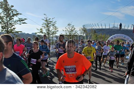 Warsaw, Poland - April 14, 2015: Orlen Warsaw Marathon. Group Of Athletes Running On A Street.