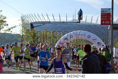 Warsaw, Poland - April 14, 2015: Orlen Warsaw Marathon. Group Of Athletes Running On A Street.