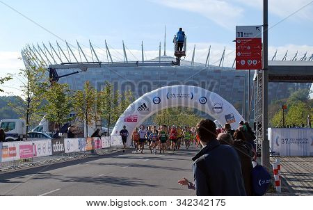 Warsaw, Poland - April 14, 2015: Orlen Warsaw Marathon. Group Of Athletes Running On A Street.