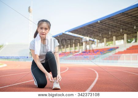 Athlete Girl Trying Running Shoes Getting Ready For Jogging On Track At Studium, Sport And Healthy C