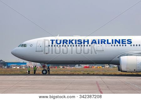 Kathmandu, Nepal - November 22 2019: A Turkish Airlines Boeing 777er Waiting For Clearance On Taxiwa