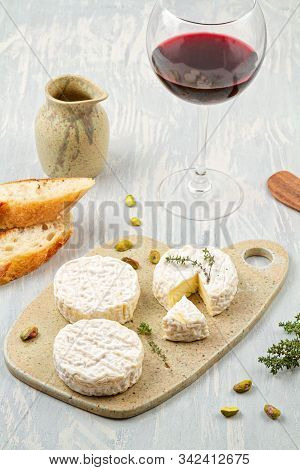 French Cheese Plate And A Glass Of Wine For Buffet Party. Traditional French Or Italian Entires