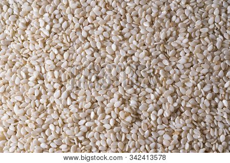 Closeup Of Lots Of Toasted Sesame Seeds.
