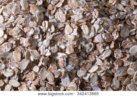 Rolled Oat. Oat Flakes Photo. Oat Background. Top View Closeup.