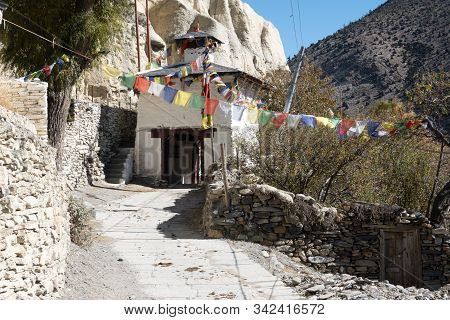 A Buddhist Chorten Stupa Entrance Into The Small Town Of Marpha In The Himalaya Mountains Of Nepal.
