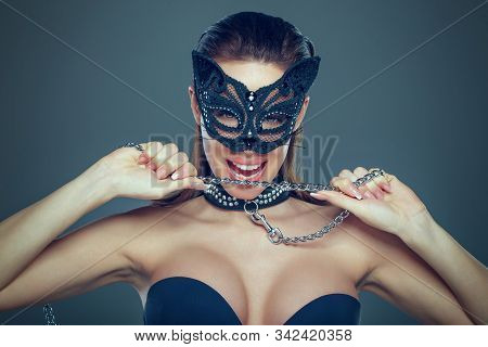 Tempting Brunette Woman In Catwoman Mask Holding Guide Chain Portrait