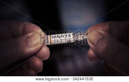 Injection Of Panacea. Ampoule In A Old Male Hands. Caring For The Health Of The Elderly. Close Up.
