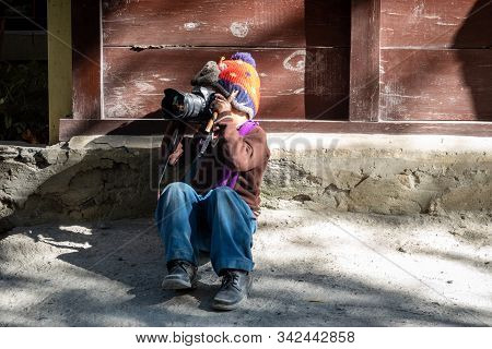 Young Boy Playing With Camera