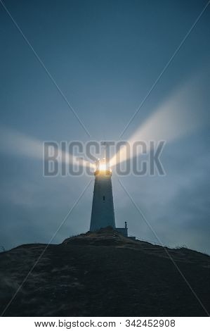 An Icelandic Lighthouse In The Moody Dark Night. Abstract Image, Dark Mood. Iceland