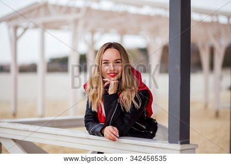 Pretty Slylish Trendy Hipseter Girl With Red Kiss Lips In Rock Black Lether Jacket Outdoors In The C