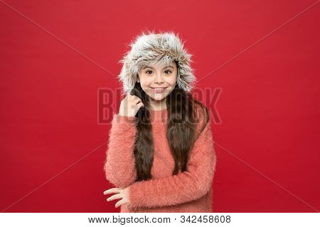 Warm Hat For Cold Winter Weather. Kid Girl Red Background. Soft Furry Accessory. Winter Season. Shop