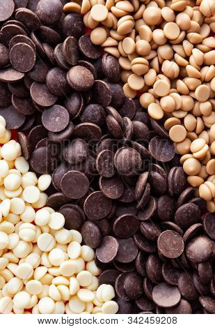 Dark, White And Caramelized Couverture Chocolate Callets Background. Modern Food Concept.
