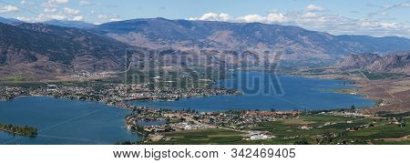 Aerial Panoramic View Of A Small Touristic Town During A Beautiful Sunny Summer Day. Taken In Osoyoo