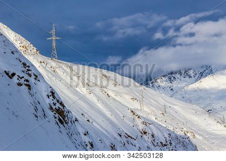 High Voltage Power Line High In The Mountains.