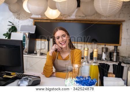Charming Young Woman Working As A Barista In The Cafe