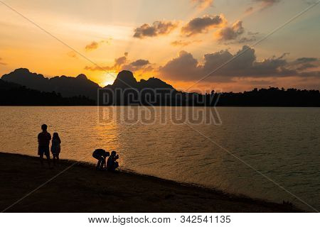 Tourists Watching Sunset At Ratchaprapa Dam, Or Known As Cheow Lan Dam