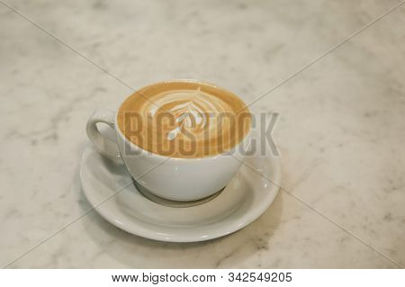 A Cup Of Fresh Tasty Cappuccino Coffee On A Marble Table.