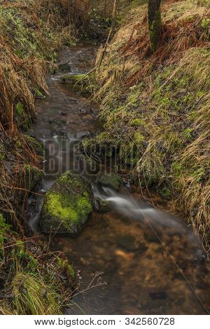 Upper Watercourse Of Bilina River In Krusne Hory Mountains In Winter Dark Day